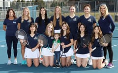 2022-2023 undefeated Varsity Girls tennis team. Taylor Moberg standing in the middle.