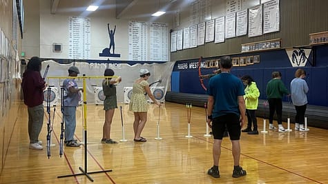 Archery Club students shooting arrows