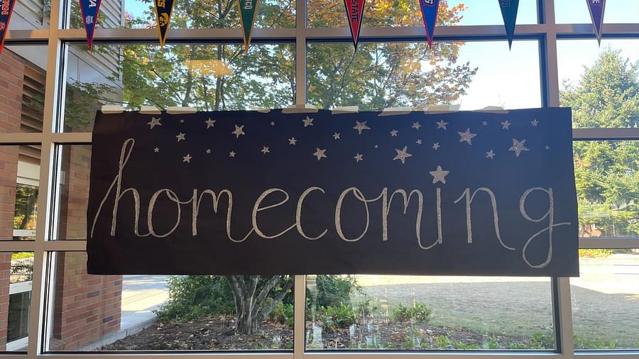 A homecoming poster hangs in the commons of Rogers High School.