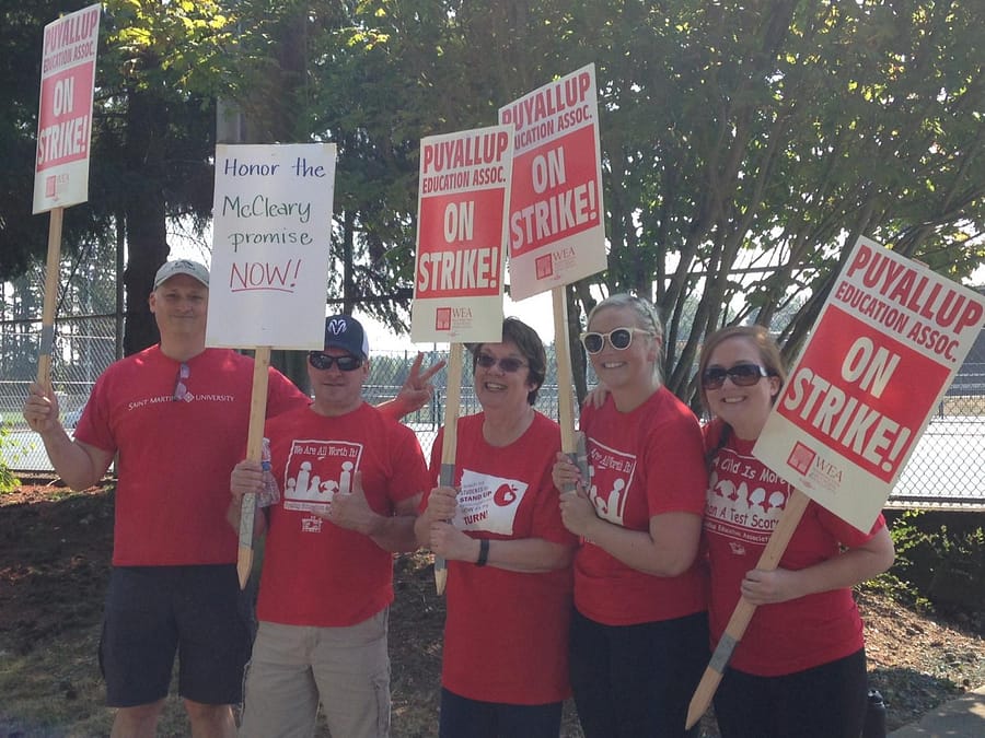 Teachers Don Clise, Tony Barager, Diane King, Brittany Langston, and Colleen Pancake picketing outside the school on Sept. 5. 